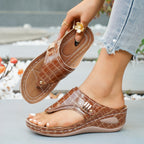 Women's trendy faux leather toe post wedge sandals with mid-heel, featuring comfortable straps and stylish design.