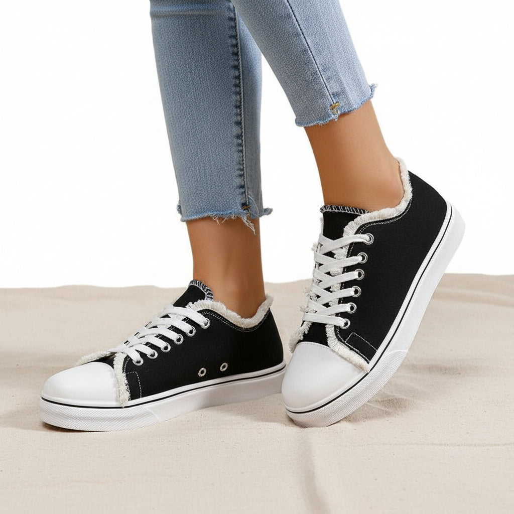 Plush Fashion Hub women's lace-up canvas sneakers with lightweight flat low-top design, casual footwear for everyday wear.
