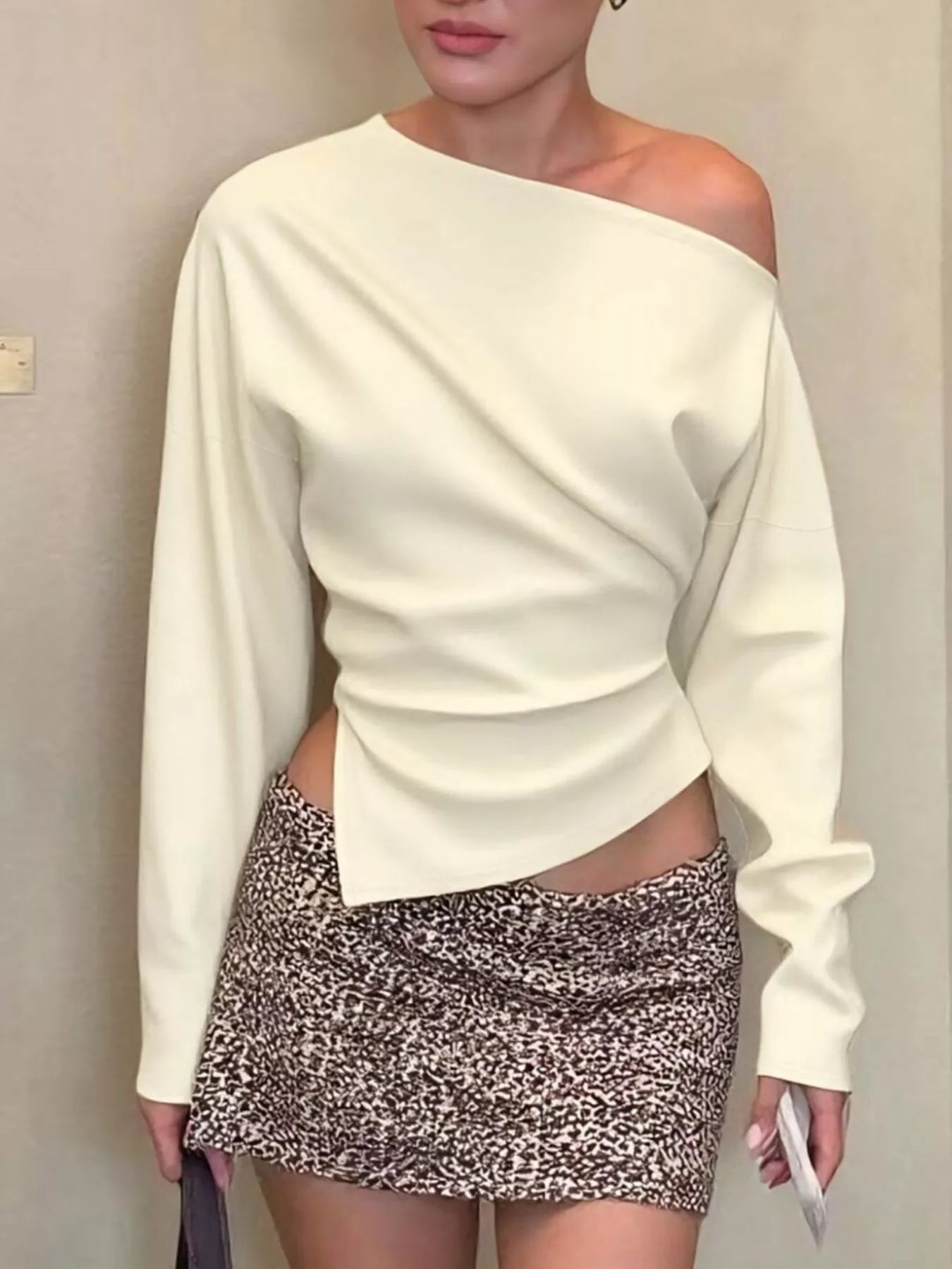 Asymmetrical off-shoulder long sleeve T-shirt by Plush Fashion Hub, featuring a stylish design and soft fabric in a modern top style.