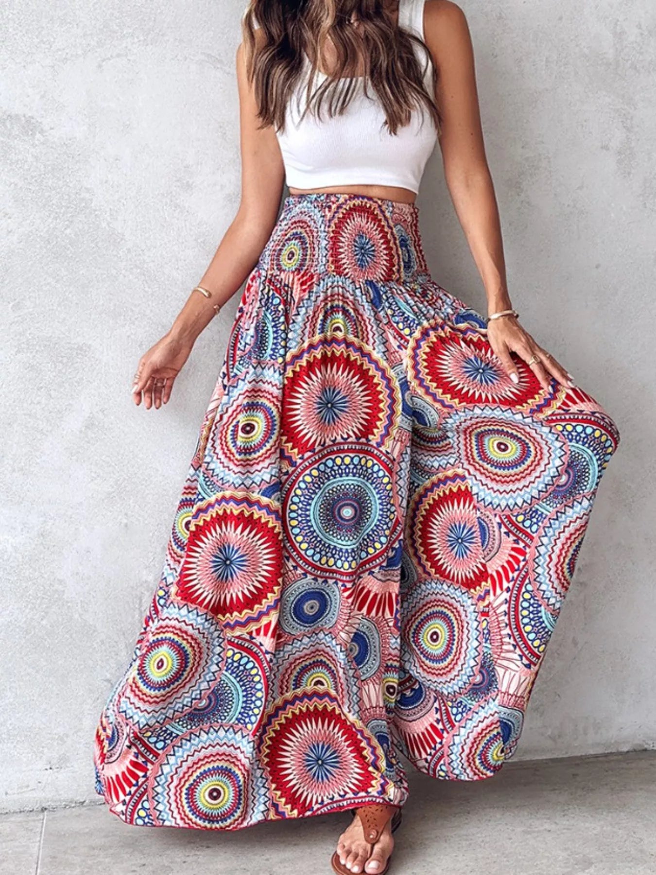 Printed wide-leg pants by Shopimist featuring a flowy design and bold pattern, shown on a model standing against a neutral background.