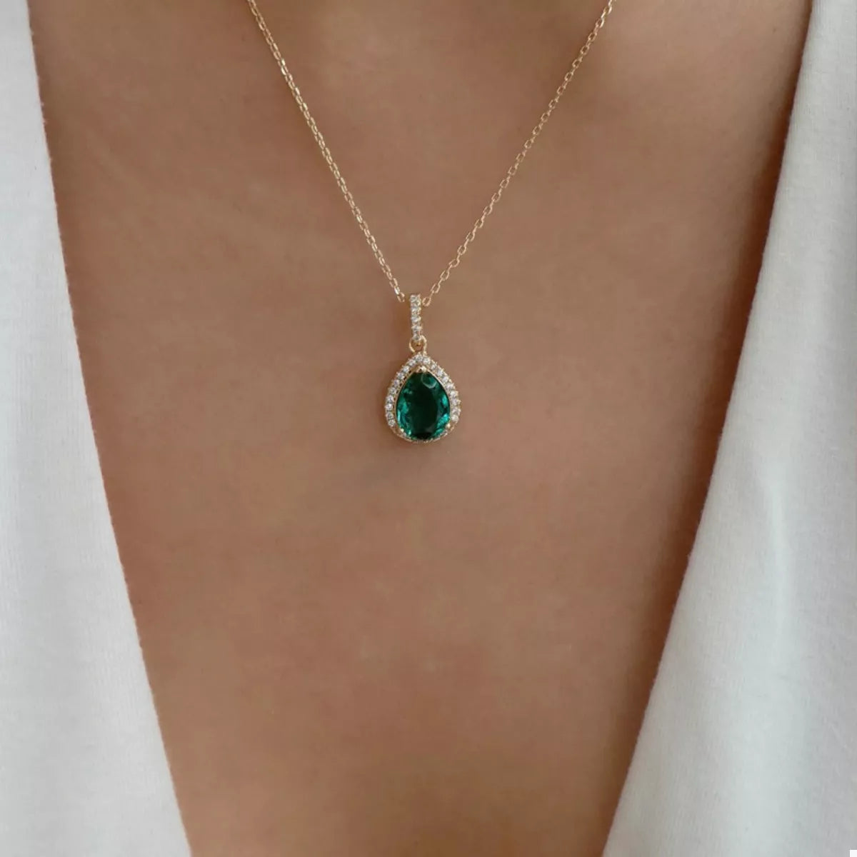 18K gold-plated teardrop pendant necklace with delicate chain, showcasing elegant jewelry design on a neutral background.