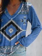 Plus size Geometric print V-neck long sleeve T-shirt from Trendsi with a comfortable casual fit, featuring bold geometric patterns.