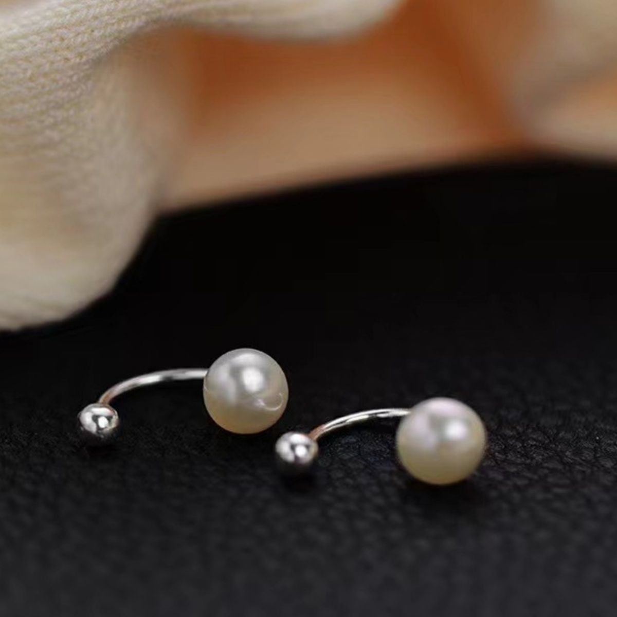 925 Sterling Silver Pearl Stud Earrings with round white pearls and silver posts, stylish and elegant jewelry accessory.