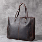 Simple retro first layer cowhide large-capacity men's handbag with a minimalist design from Plush Fashion Hub.