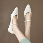 Women's floral detail FitiqueFit pointed toe low square heel buckle flats, stylish dress shoes with floral accents on beige background.