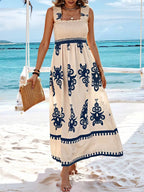 Plush Fashion Hub smocked printed wide strap maxi dress with floral pattern and flowing silhouette, perfect for summer wear.