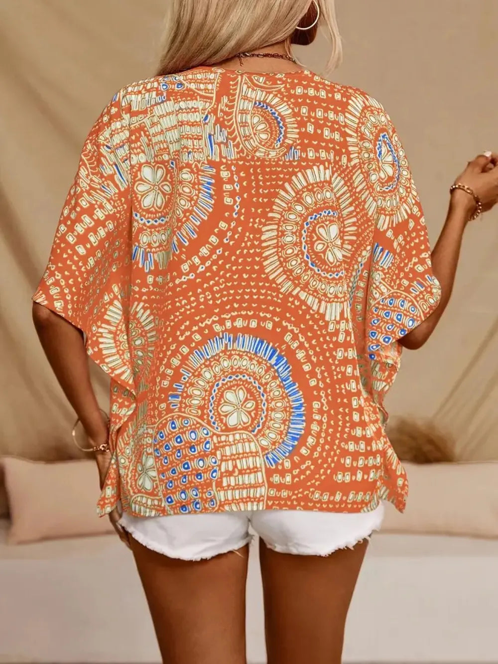 Women's printed V-neck half sleeve casual top by Plush Fashion Hub, soft stretch fabric, perfect for office or casual wear.