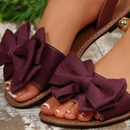 Shopimist Bow open toe sandals featuring stylish straps and a comfortable flat sole, perfect for casual summer wear.