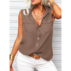 Women's sleeveless top with lapel collar, loose fit, solid color, and front pockets by Plush Fashion Hub.