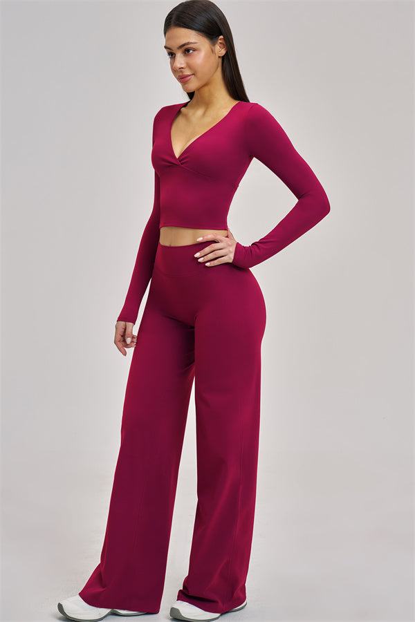 Fitglutes Activewear long sleeve crop top with fitted design, shown on a model for gym and workout wear.