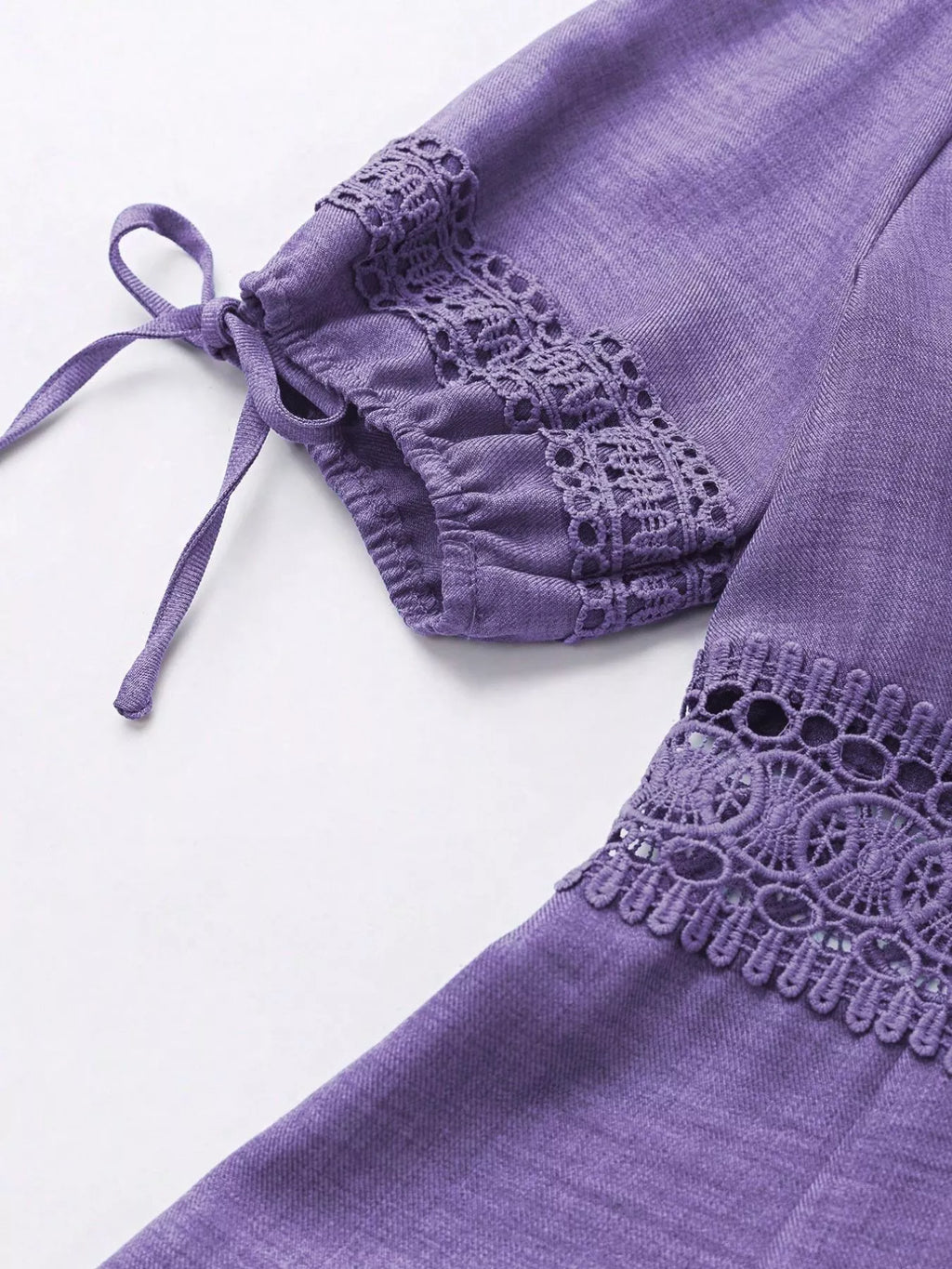 Lace detail V-neck mini dress from Shopimist featuring elegant lace accents and a fitted silhouette.