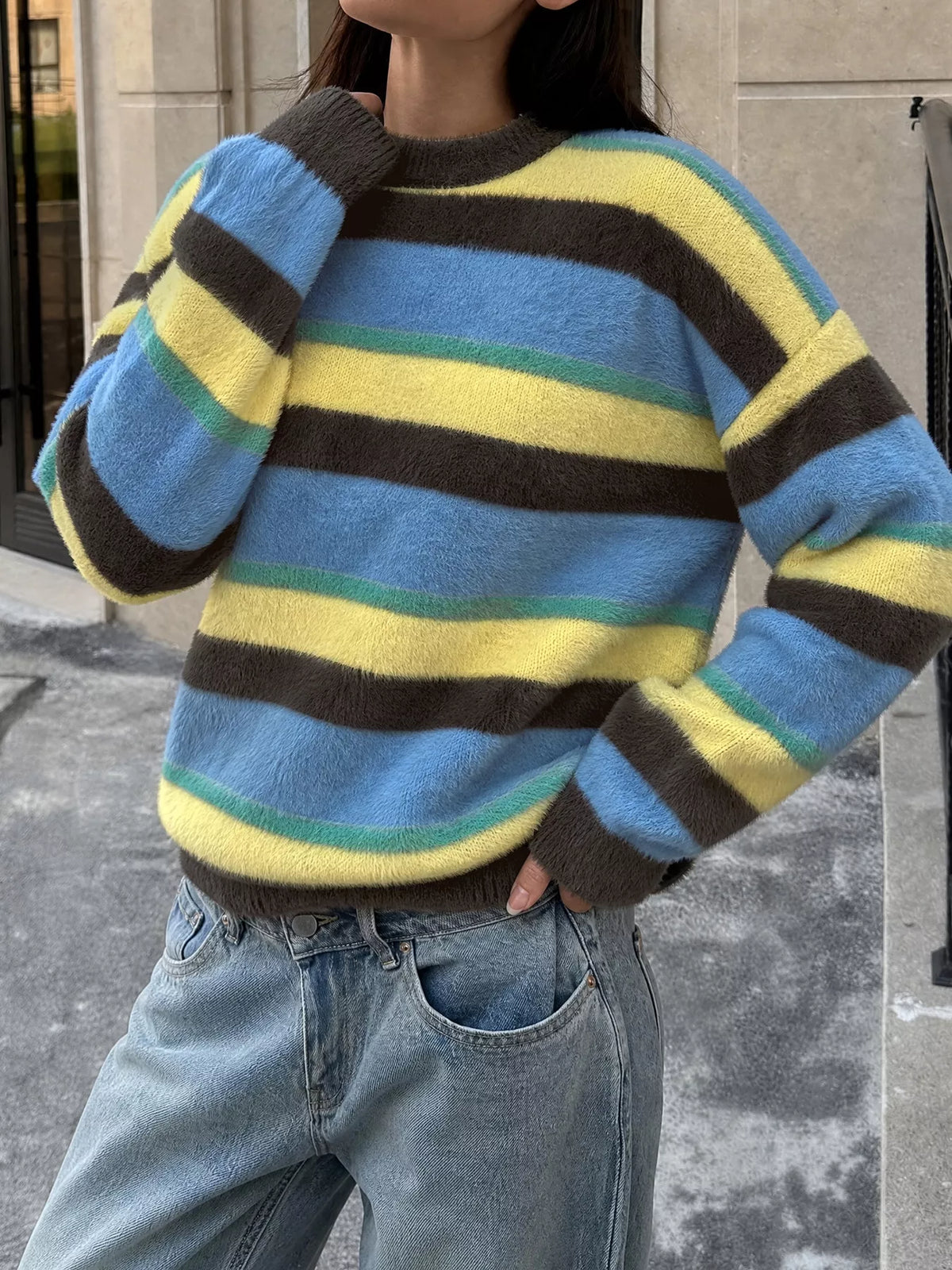Striped dropped shoulder sweater in soft knit fabric, featuring bold horizontal stripes and relaxed fit from Trendsi.