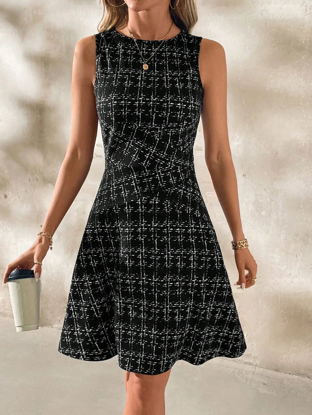 Shopimist round neck sleeveless dress with a fitted bodice and flowy skirt, perfect for casual or summer wear.