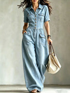 Plus size denim wide-leg jumpsuit with chest pockets, stylish and comfortable Trendsi jumpsuit designed for a relaxed fit.