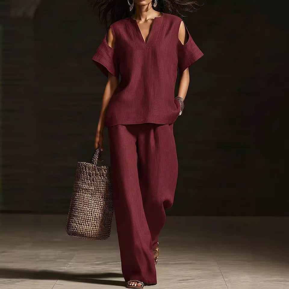 FitiqueFit V-neck short sleeve top and straight-leg pants set with ripped details and pockets in a solid color.