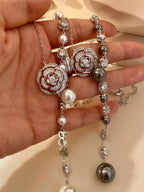 Pearl flower Y-necklace by Shopimist featuring white pearls and floral design on a delicate gold chain.