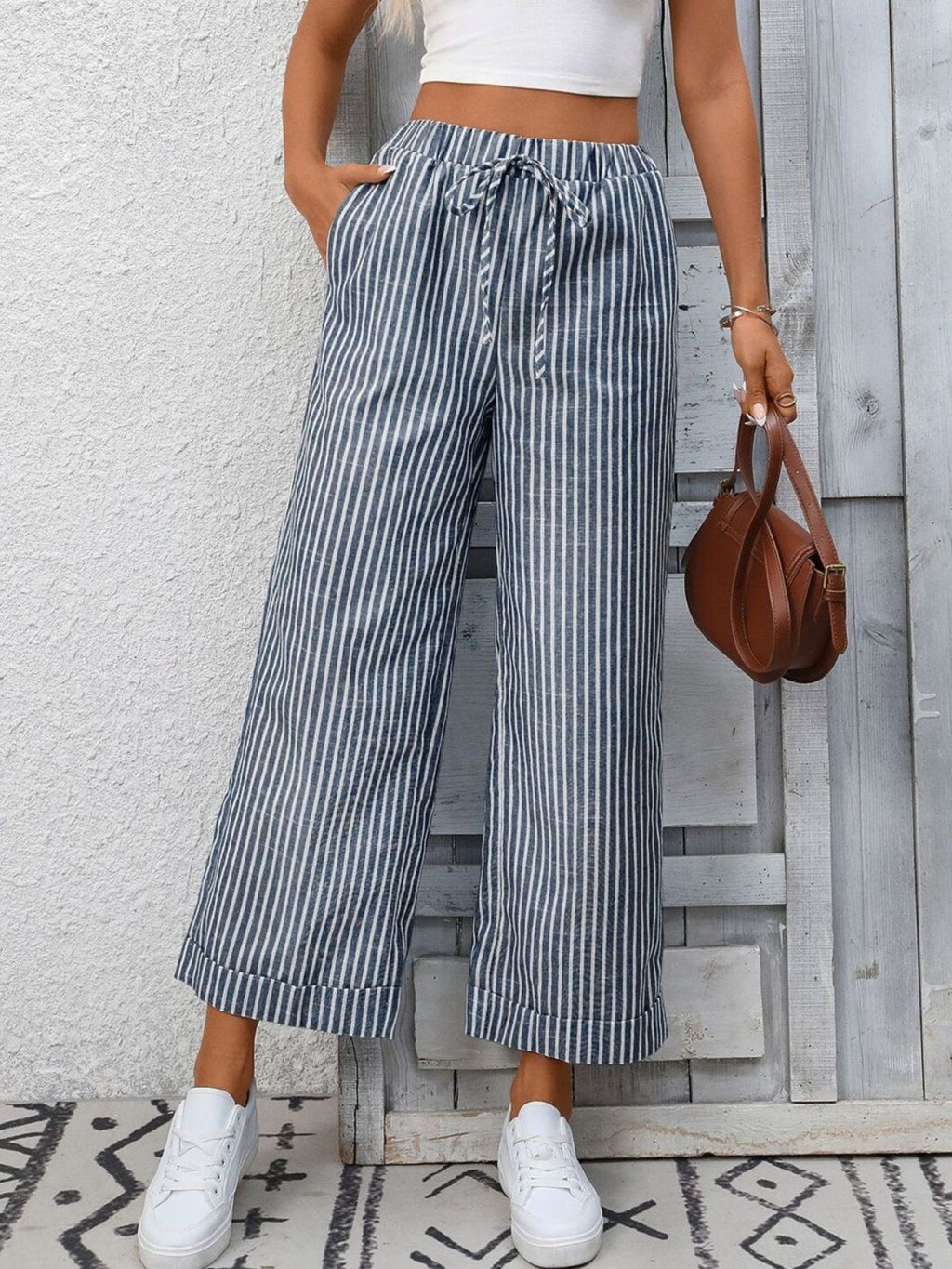Women’s striped wide-leg drawstring pants with pockets by Trendsi, featuring a relaxed fit and stylish design.