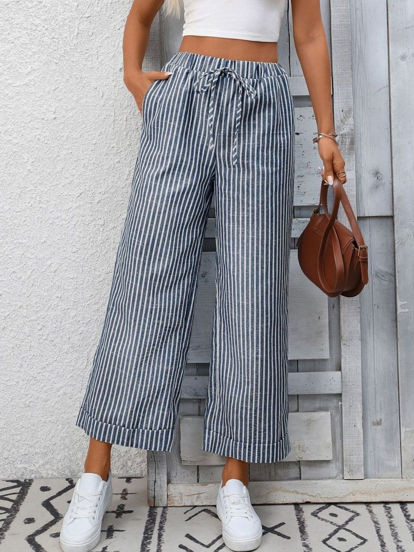 Women’s striped wide-leg drawstring pants with pockets by Trendsi, featuring a relaxed fit and stylish design.