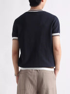 Men's plus size contrast trim T-shirt from Trendsi featuring a short sleeve design and a stylish color contrast trim.