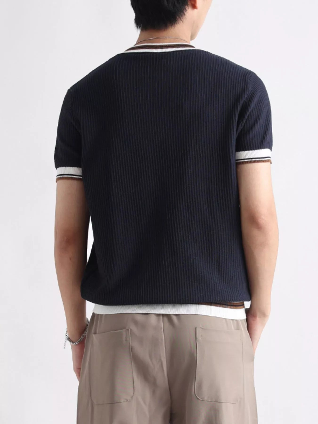 Men's plus size contrast trim T-shirt from Trendsi featuring a short sleeve design and a stylish color contrast trim.