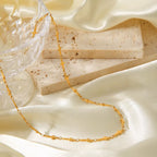 18K gold-plated cross necklace with chain, stylish jewelry piece from Shopimist, close-up view showing detailed design