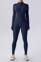 Black half zip mock neck active jumpsuit by Trendsi, made for comfortable, stylish workout or athleisure wear.