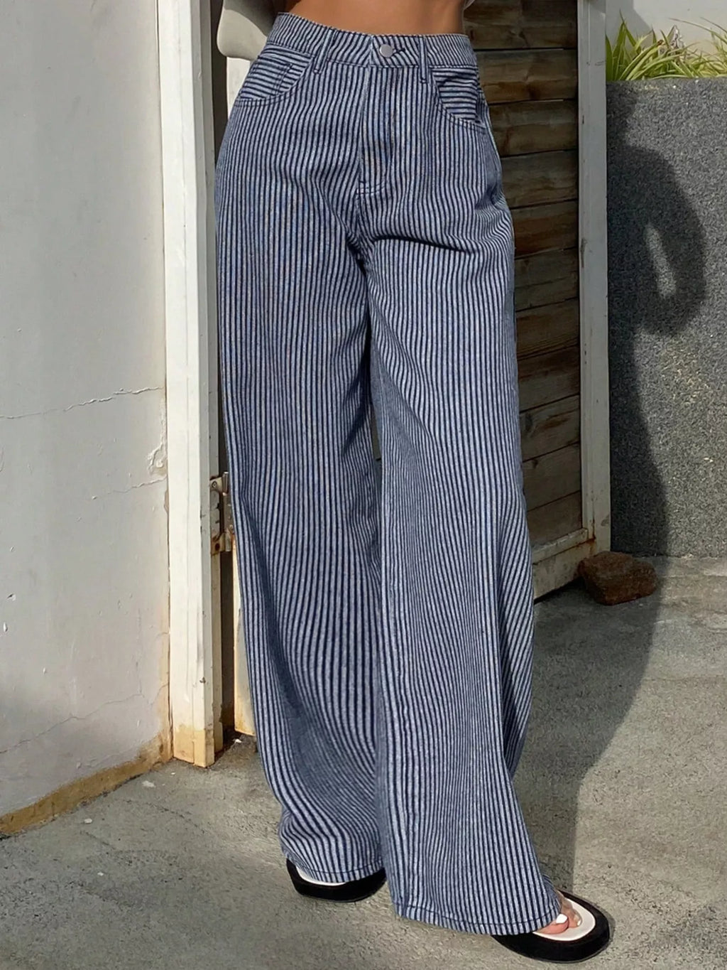 Striped wide-leg jeans by Shopimist featuring a high-rise fit, bold vertical stripes, and relaxed silhouette on a white background.