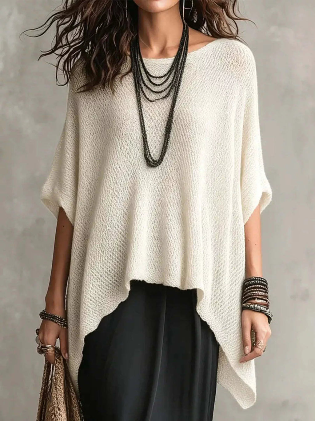 Plus size loose knit round neck top from Trendsi, featuring a cozy, full-size knit fabric and stylish round neckline.