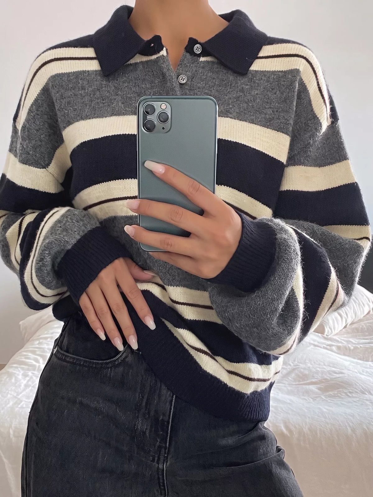 Striped long sleeve sweater from Plush Fashion Hub with button details, featuring a cozy knit texture and classic design.