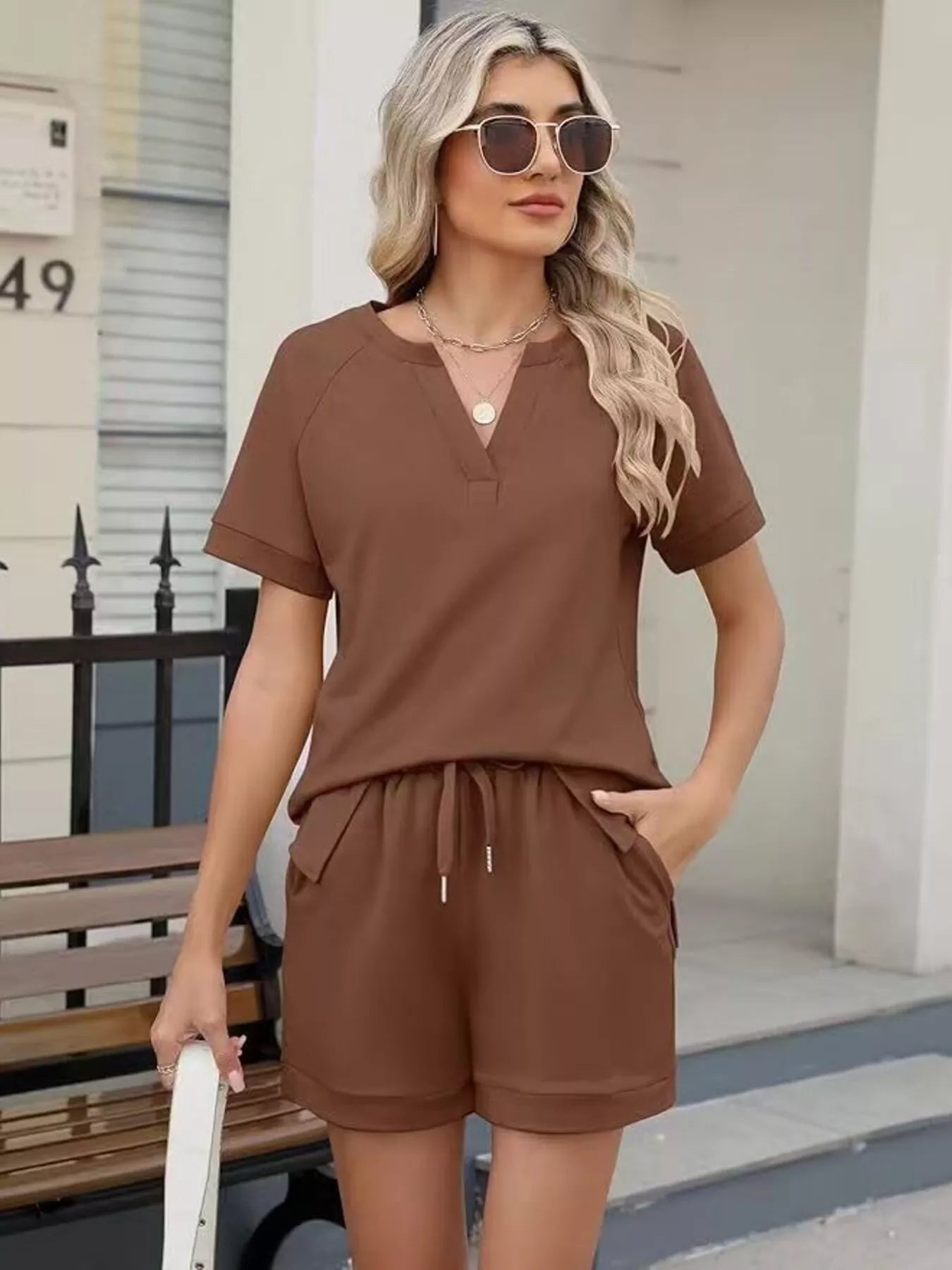 Solid color short sleeve top and shorts two-piece set from Trendsi, casual summer outfit with comfortable fabric and simple design.