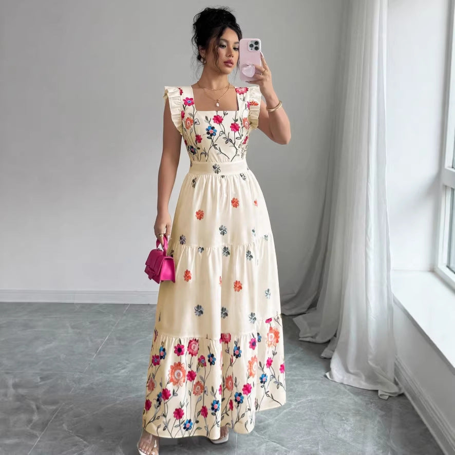 Women’s floral print waist-cinching dress with puff sleeves by FitiqueFit, showcasing a feminine silhouette and vibrant pattern.