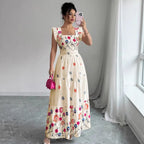 Women’s floral print waist-cinching dress with puff sleeves by FitiqueFit, showcasing a feminine silhouette and vibrant pattern.