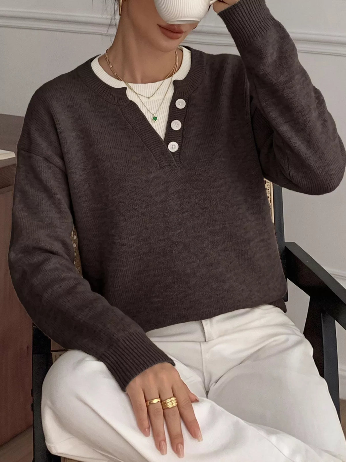 Ribbed knit sweater with button placket from Trendsi, featuring a cozy, fitted design in neutral tones.