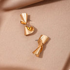 18K gold-plated twist earrings featuring sleek, modern design, perfect for elegant accessories.