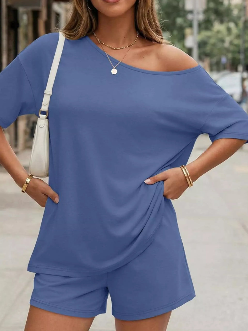 Plus size full size one-shoulder top and shorts set from Plush Fashion Hub, stylish casual outfit with a modern design.