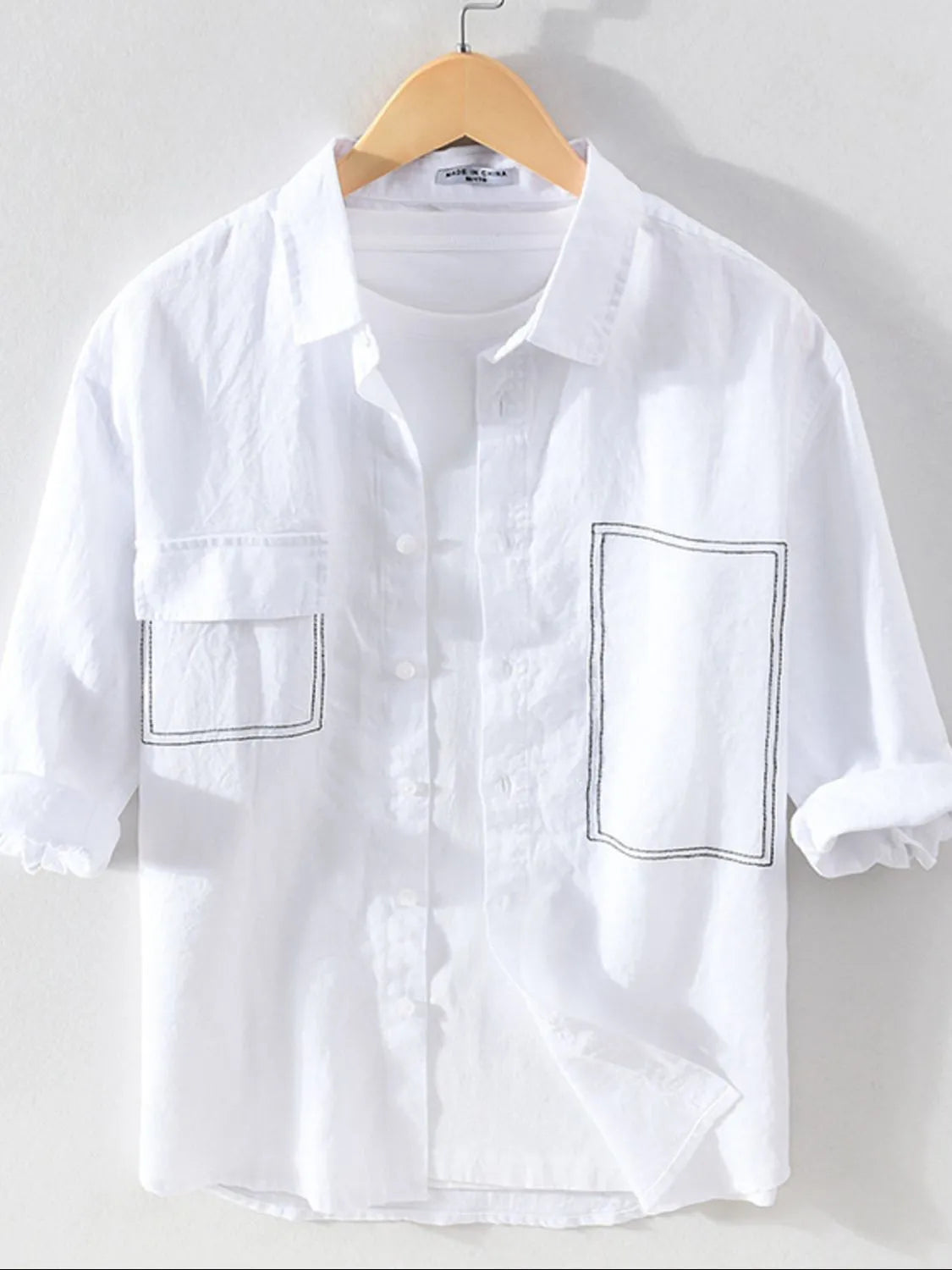 Men's plus size button-up shirt with chest pocket from Trendsi, featuring a casual, comfortable fit and classic design.
