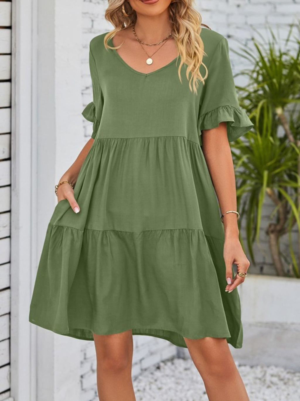 Lightweight rayon ruffled sleeve tiered mini dress with pockets, stylish and feminine, by Trendsi.