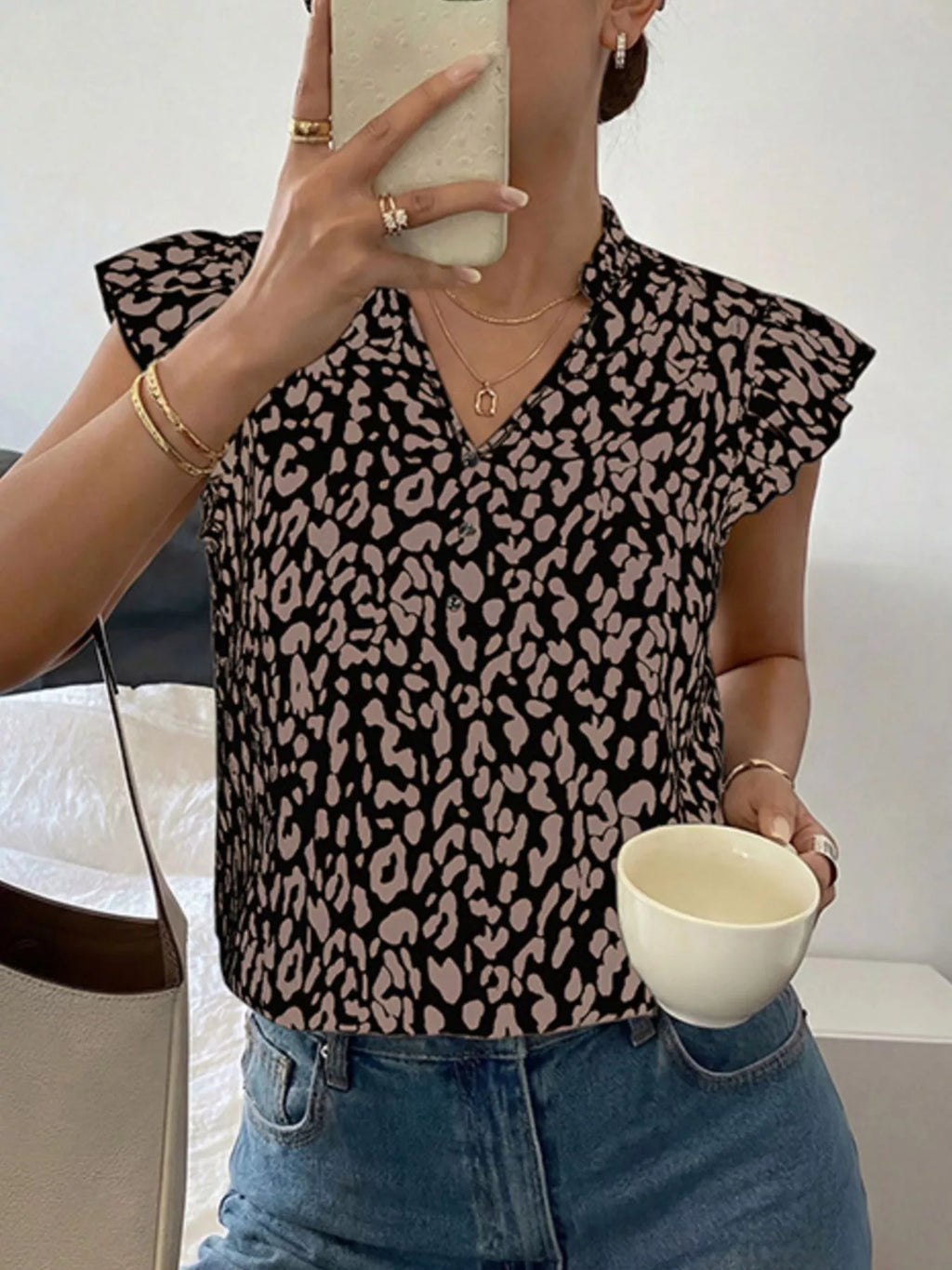 Leopard print ruffle sleeve blouse from Plush Fashion Hub featuring stylish ruffle details and a trendy animal print design.