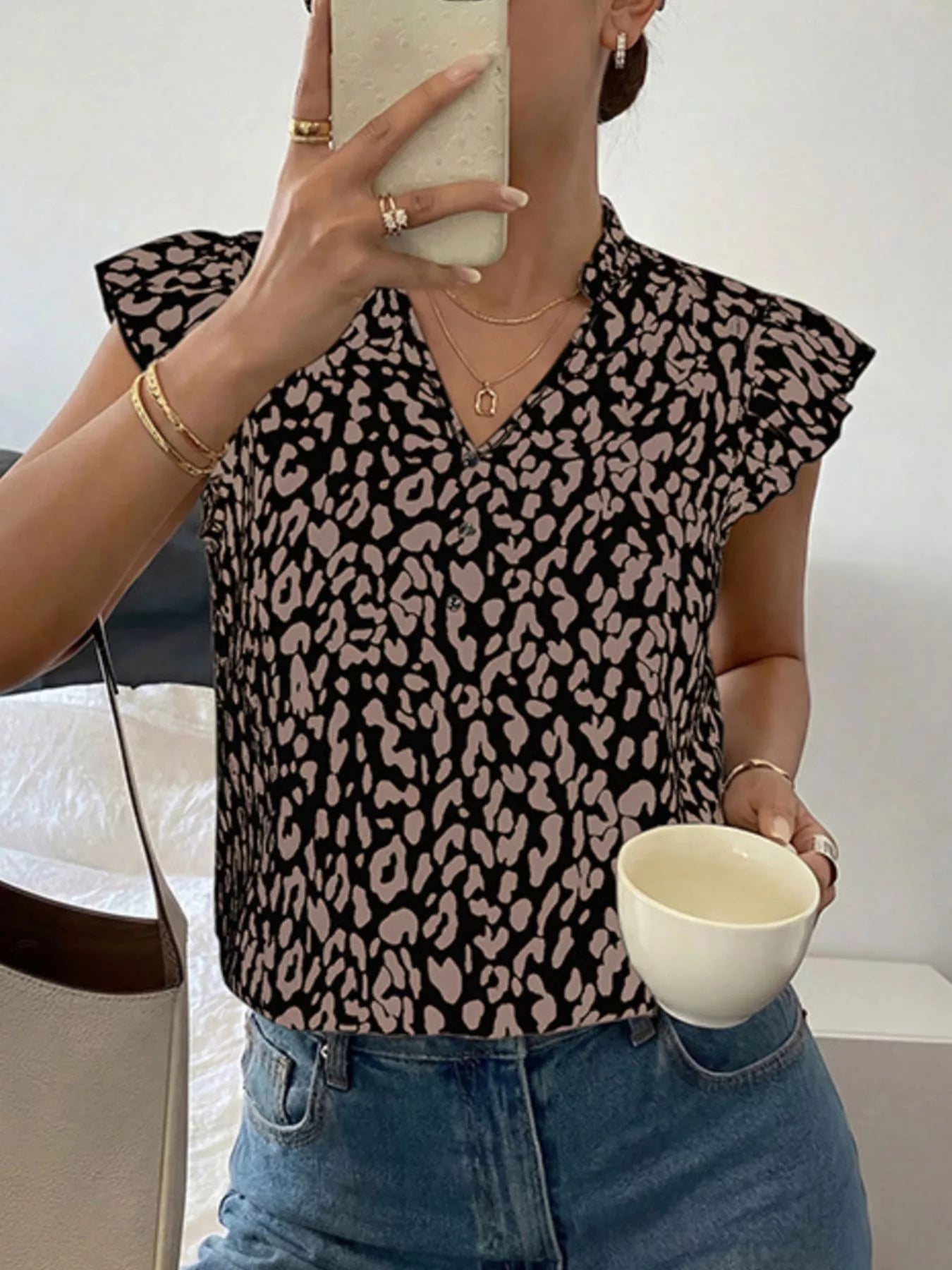 Leopard print ruffle sleeve blouse from Plush Fashion Hub featuring stylish ruffle details and a trendy animal print design.
