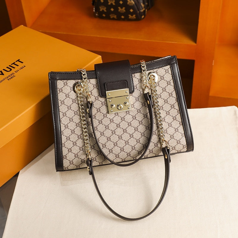 Genuine leather fashion women's bag with sleek design, featuring top handles and spacious interior for stylish daily use.