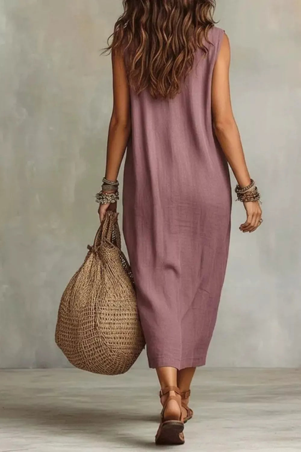 Sleeveless drape neck midi dress by Plush Fashion Hub, showcasing flowy fabric and elegant design.