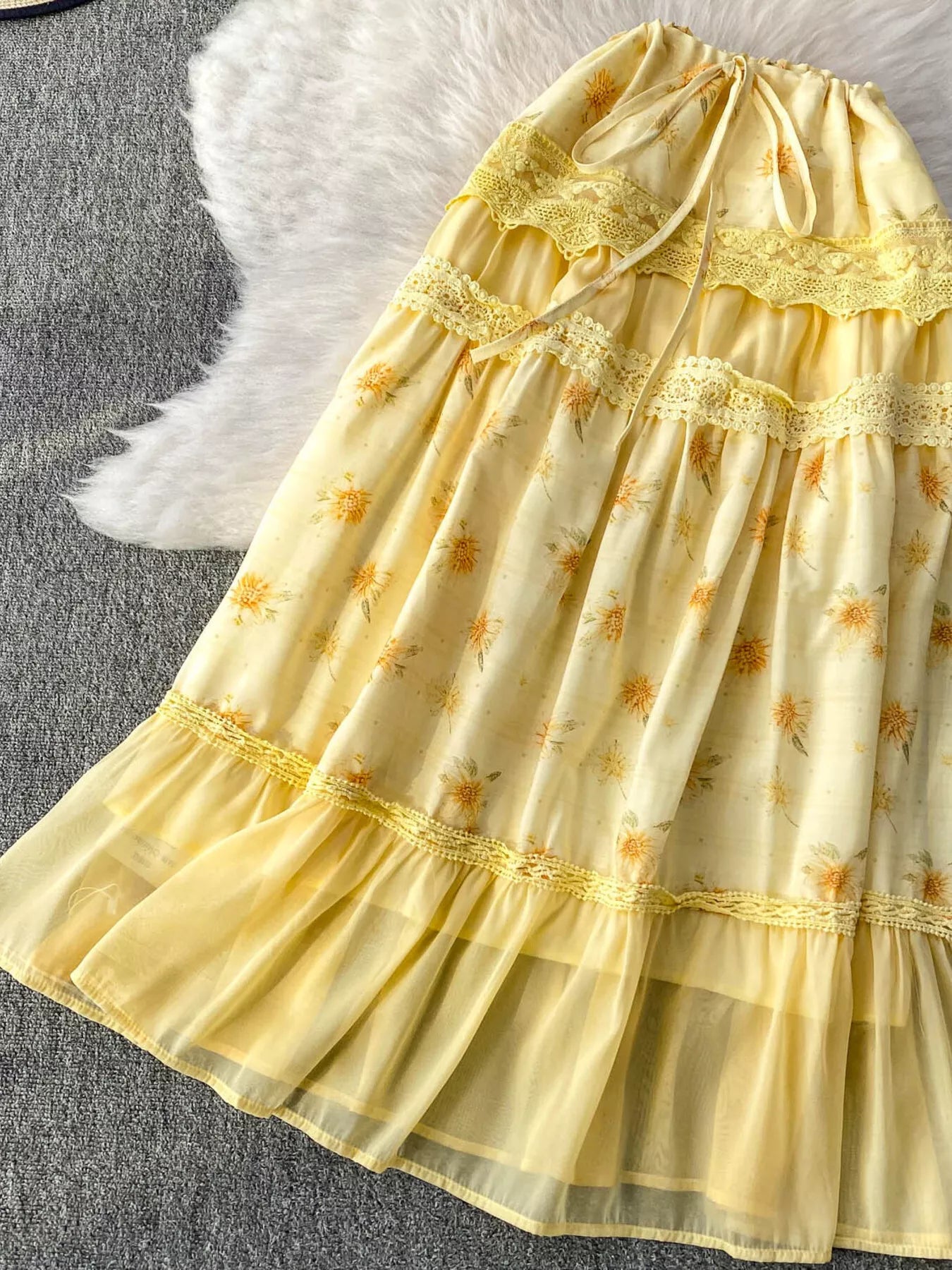 Shopimist smocked floral top and skirt set featuring a lightweight, patterned fabric with ruffled details and a fitted bodice.