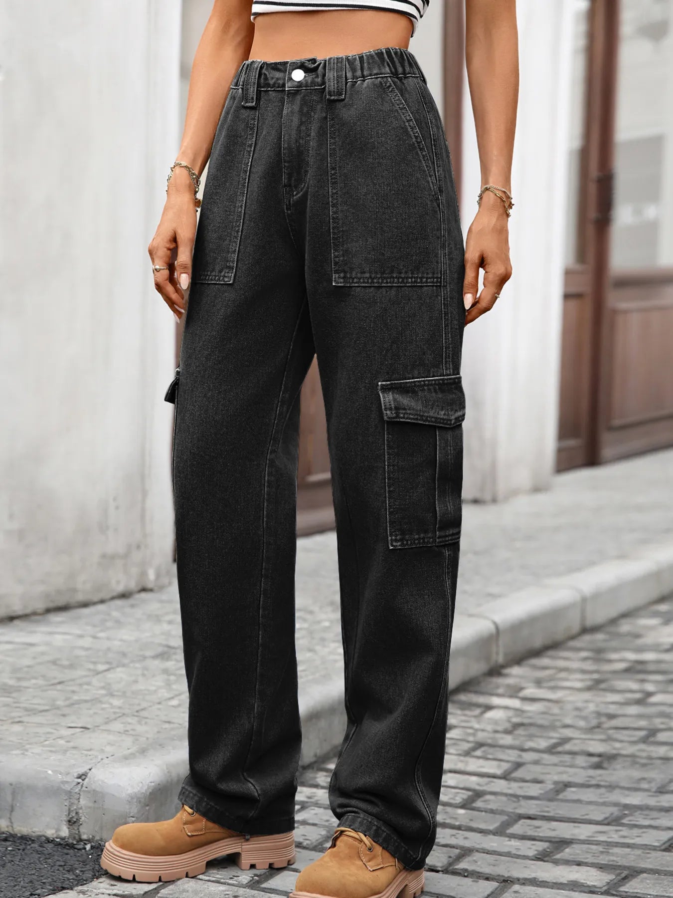 High-waisted cargo jeans from Plush Fashion Shop, featuring denim material, multiple pockets, and a modern relaxed fit.