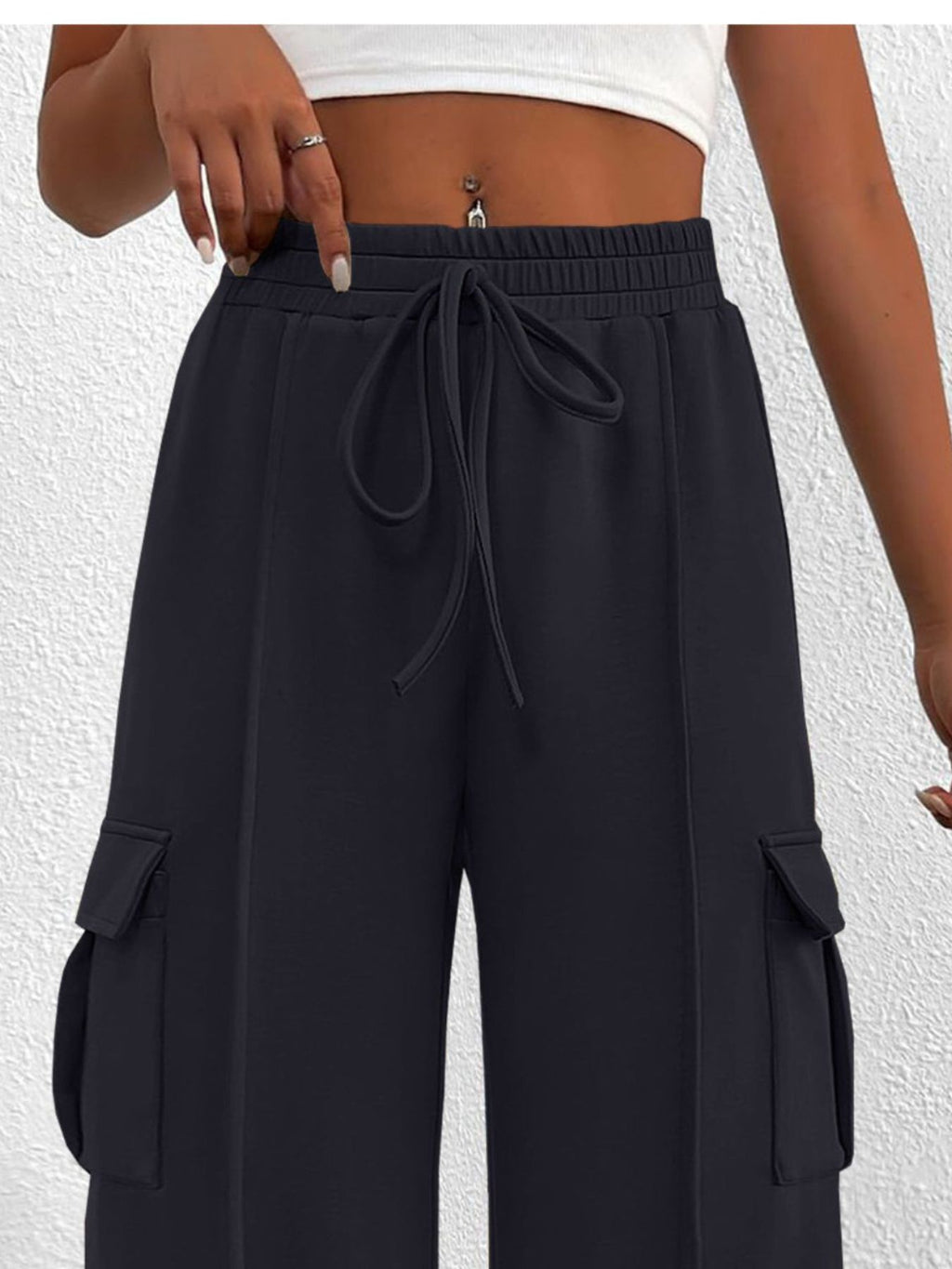 Women's high-waisted casual cargo pants with drawstring, lightweight utility pants from Trendsi, featuring multiple pockets and relaxed fit.