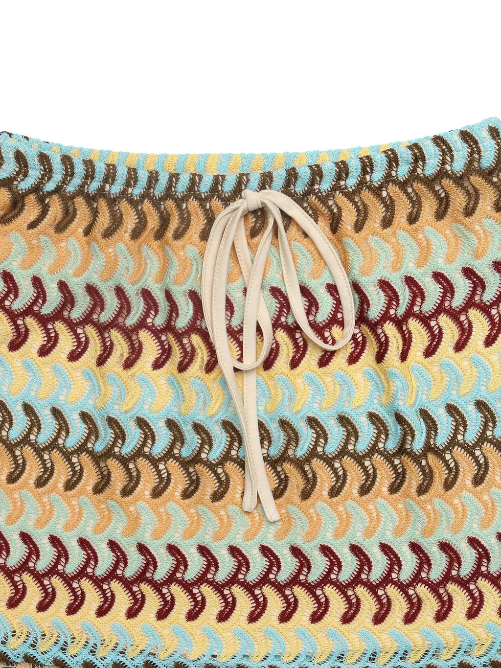 Crochet drawstring mini skirt by Trendsi featuring a textured crochet design and adjustable waistband on a neutral background.