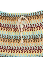 Crochet drawstring mini skirt by Trendsi featuring a textured crochet design and adjustable waistband on a neutral background.