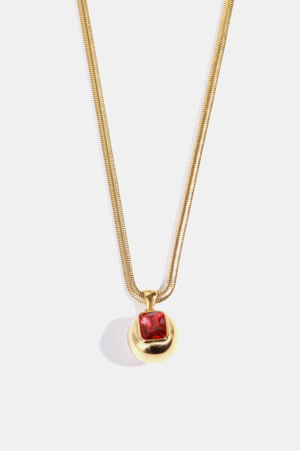 Gold-plated Zircon geometrical shape pendant necklace with sleek design, showcasing a modern jewelry piece.