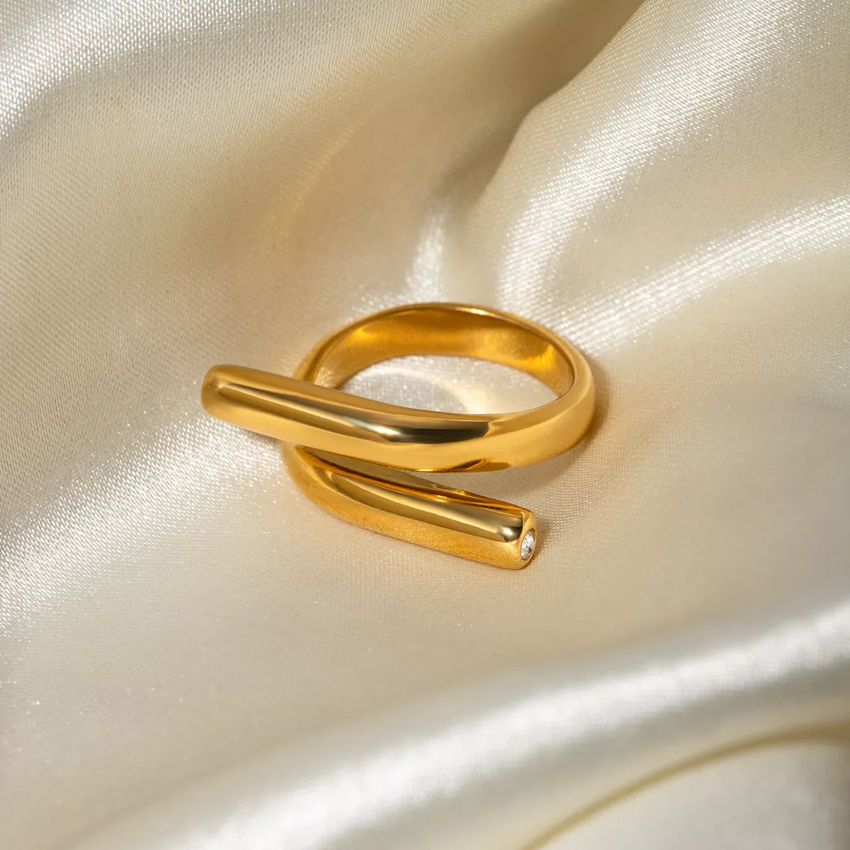 Stainless steel bypass ring from Plush Fashion Hub featuring a sleek, modern design for stylish jewelry wear
