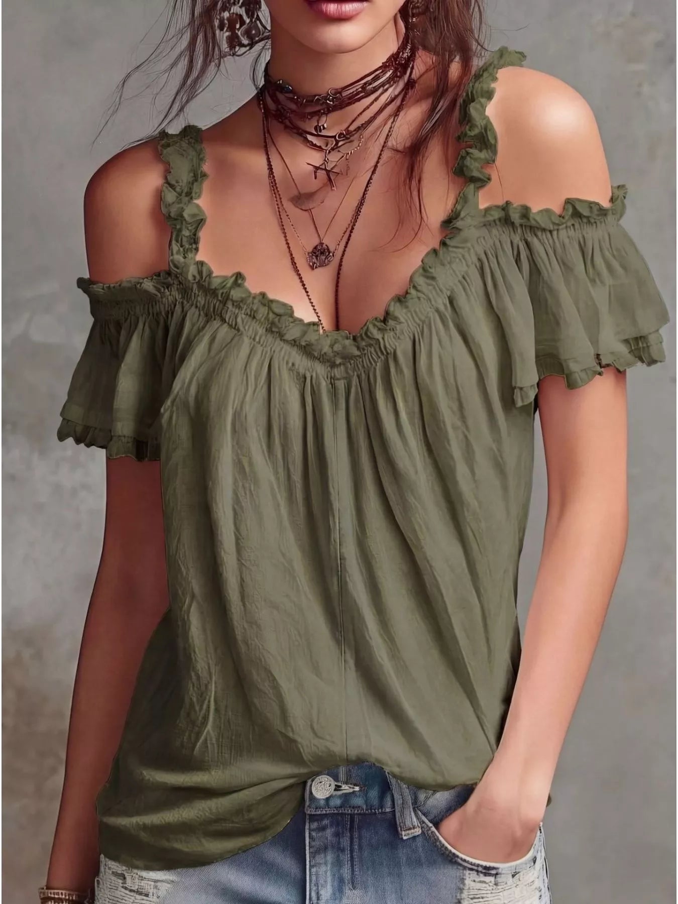 Plush Fashion Hub frill cold shoulder blouse featuring ruffled sleeves and a relaxed fit, displayed on a mannequin.