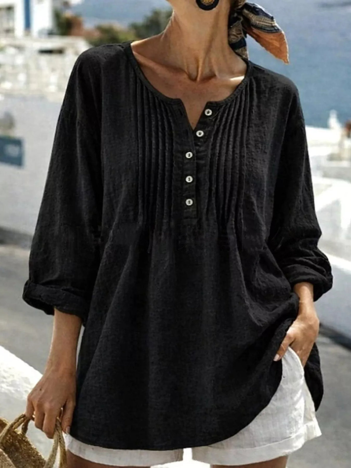 Casual long sleeve linen shirt with button details, featuring a relaxed fit and neutral color, by Trendsi.